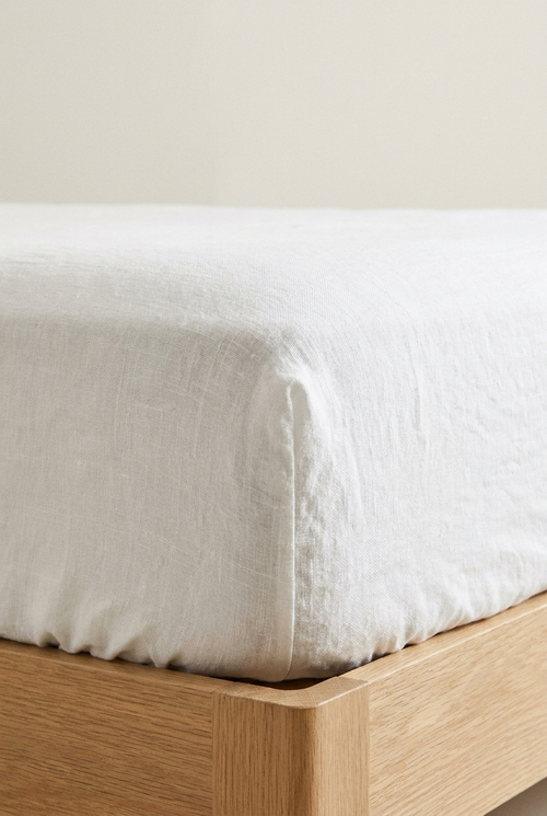 Premium European Linen Fitted Sheet in White — corner detail with elastic